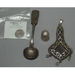 A reproduction Art Nouveau silver pendant, an Edward l penny and two other pieces.