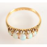 An 18ct gold ring set five opals.