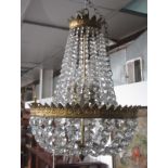 A cut glass and gilt metal chandelier, with clear glass drops, height 40cm.