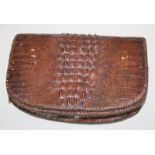 An alligator leather handbag, with suede lining, 16 x 23cm.