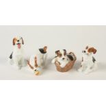 Four Royal Doulton models of dogs.