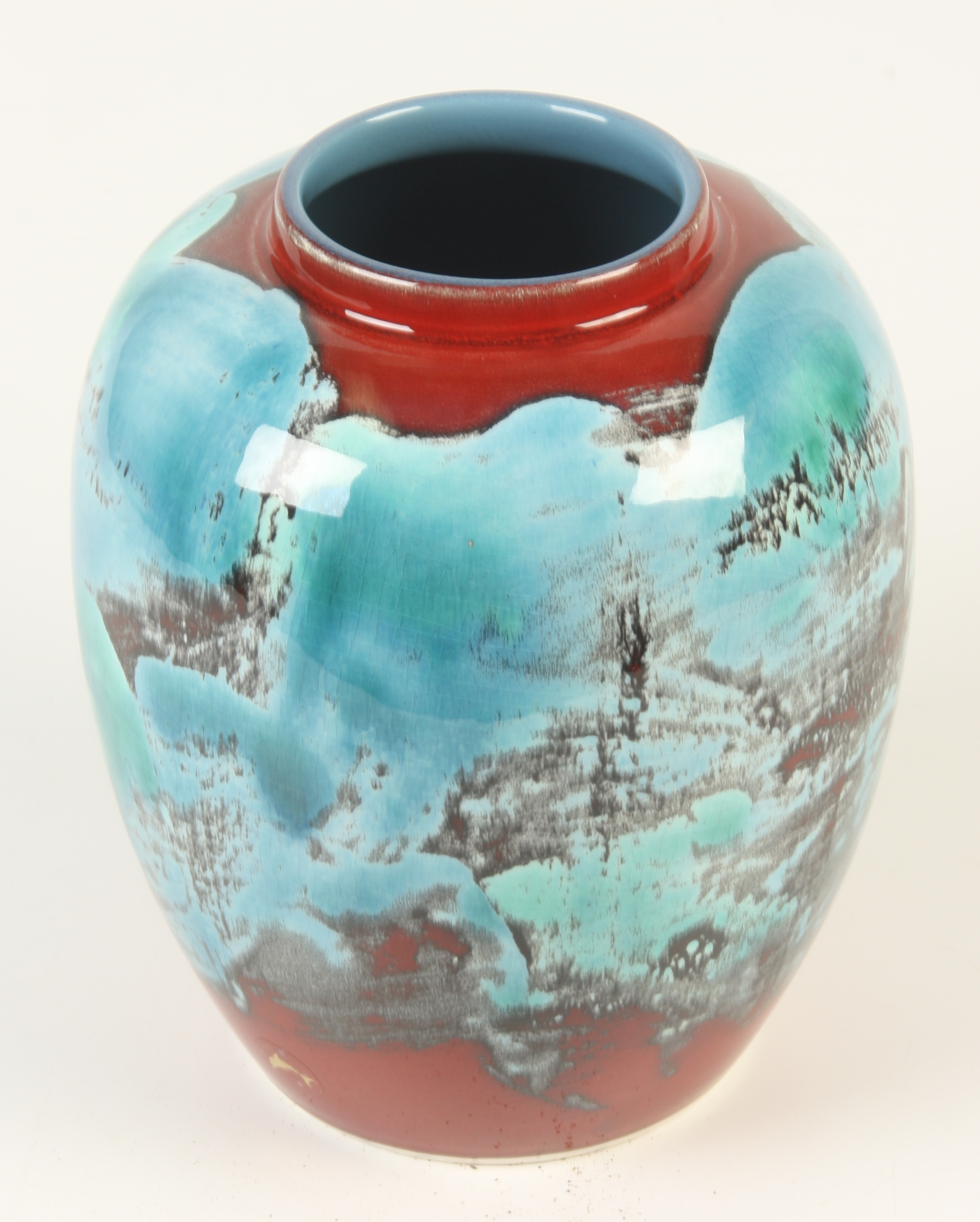 A late 20th century Poole pottery vase, of globular form with abstract designs, height 21.5cm.