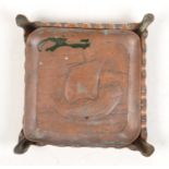 A Newlyn Copper pin tray, repousse decorated with a galleon,