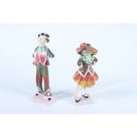 Two Royal Doulton figures, 'Pearly Boy' and 'Pearly Girl', heights 14cm and 13.5cm.