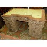 A late Victorian carved oak twin pedestal English desk, with locks by Hobbs, width 137cm.