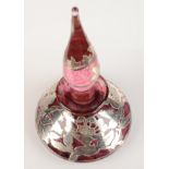 A silver overlay glass perfume bottle.