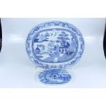 A large meat plate from the first half of the 19th century, blue printed with a willow pattern, 56.