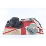 A black leather, sheepskin lined flying helmet and two Union Jacks, 116 x 190cm and 40.5 x 69.5cm.