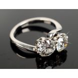 A stunning diamond cross over ring set in platinum each stone has an EDR "European Diamond Report"