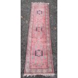 A Caucasian design runner, the pink ground with three Sewan type medallions,