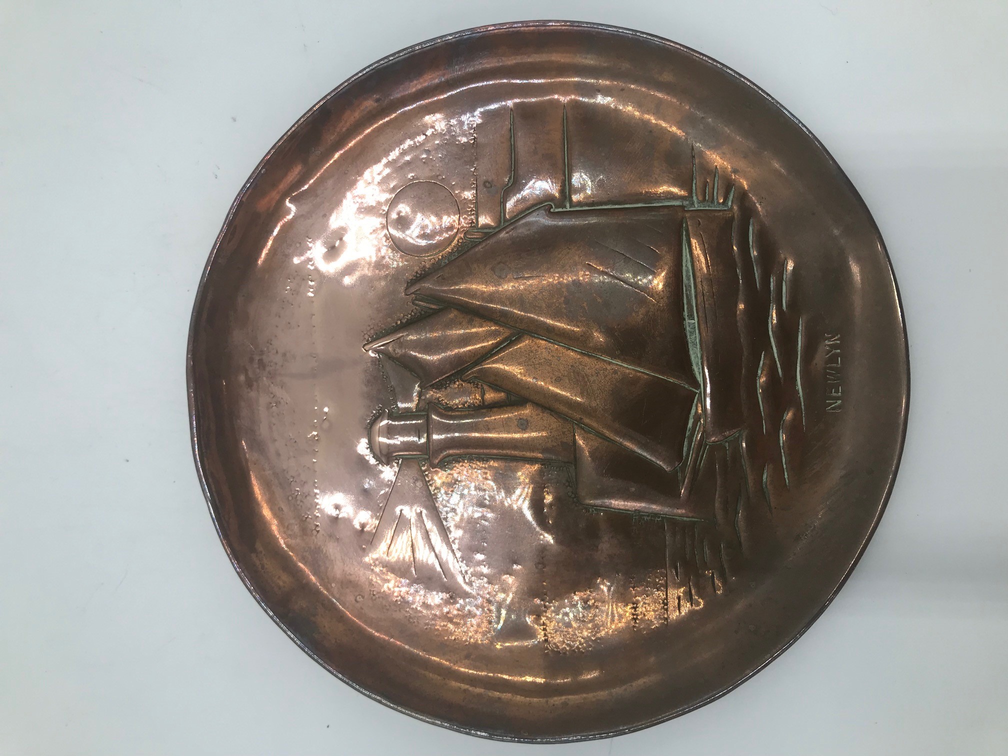 A Newlyn copper circular tray, diameter 15cm.