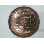A Newlyn copper circular tray, diameter 15cm.