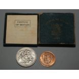 A 1951 crown, boxed and one other coin.