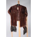 A mid brown fur cape, embroidered 'Bradleys' and monogrammed 'CCS', length 46cm,