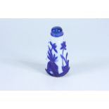 A tall tapering square section carved blue and white Peking glass snuff bottle, height 10.5cm.