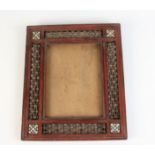A Syrian wood picture frame, early 20th century, with four square panels with bone,
