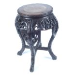 A Chinese carved hardwood marble topped jardiniere stand, 19th century, height 47.