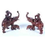 A pair of Chinese carved wood models of elephants, early 20th century, height 19cm, width 15cm.