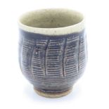 A Leach Pottery stoneware tenmoku glazed and carved tea bowl, St Ives mark, height 8.