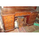 A Victorian mahogany pedestal desk, with an arrangement of nine drawers on a plinth base,