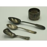 A silver caddy spoon, a teaspoon, a coffee spoon and a silver napkin ring, 2oz.