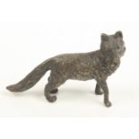 A bronze model of a fox, height 6.5cm, width 11cm.