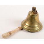 A brass ships bell, height 18cm, diameter 17.5cm.