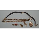 A 19th century stone set watch key, a gilt watch chain etc.