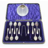 A heavy late Victorian silver mounted glass match striker and a set of eleven (of twelve) engraved