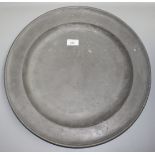 A large pewter charger, diameter 45.5cm.