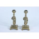 A pair of brass candlesticks, 19th century,