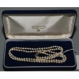 A double strand pearl necklace with silver clasp, with Mikimoto box.
