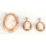 A pair of gilt mounted cameo earrings and a gold mounted cameo brooch.