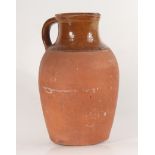 A terracotta part glazed ewer, late 19th century, height 35cm.