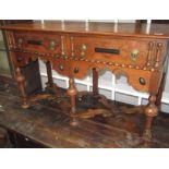 An oak Jacobean style dresser base,