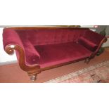 A mid 19th century mahogany sofa, with shaped arms and buttoned back.