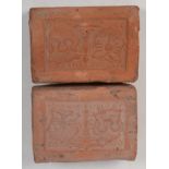 A pair of terracotta tiles, inscribed 'MAXIME DILICE', 10.5 x 8cm, depth 3.5cm.