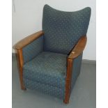 An Arts and Crafts library armchair, with crescent disc back,