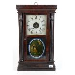 An American wall clock, by Seth Thomas, Thomaston, Conn., height 64cm, width 37.8cm.