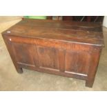 A oak coffer, late 17th century, with a triple rectangular panelled front on stile feet,