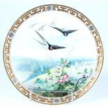 A good Minton cabinet plate, retailed by Goode, painted with a landscape over which flies swallows,