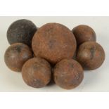 Seven small cannon balls.