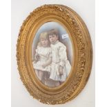 A gilt carved picture frame, 19th century, with a print of two young girls, 59 x 49cm.