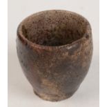 A tin miner's pottery crucible, height 7cm, diameter 7.5cm.