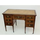 An Edwardian mahogany satinwood crossbanded knee hole dressing table,