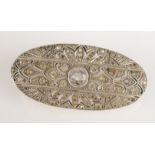 A 1920's paste set silver oval brooch.