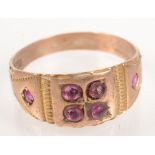 A Victorian 15ct gold ring set with rubies.