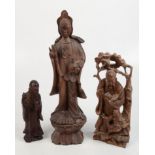 Three Chinese carved wood figures, 19th century, height of largest 46cm.