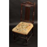 An early Victorian rosewood small chair, with needlework seat.