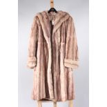 A purple and white striped lady's fur coat, with taupe satin lining, length 118cm, size 14/16.